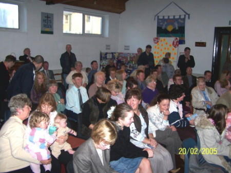 The Congregation at the Baptism Service
