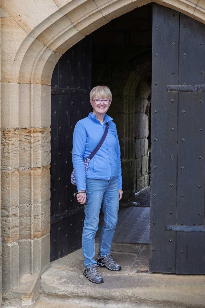 Pat outside the gate of Warkworth Castle